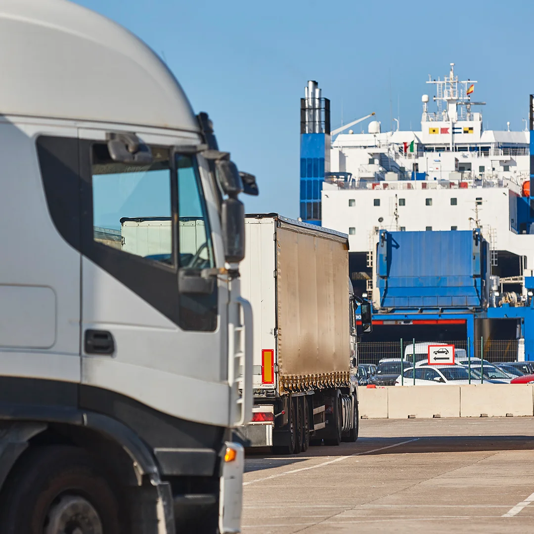 Transportation and logistic industry. Trucks and vessel ready to be loaded